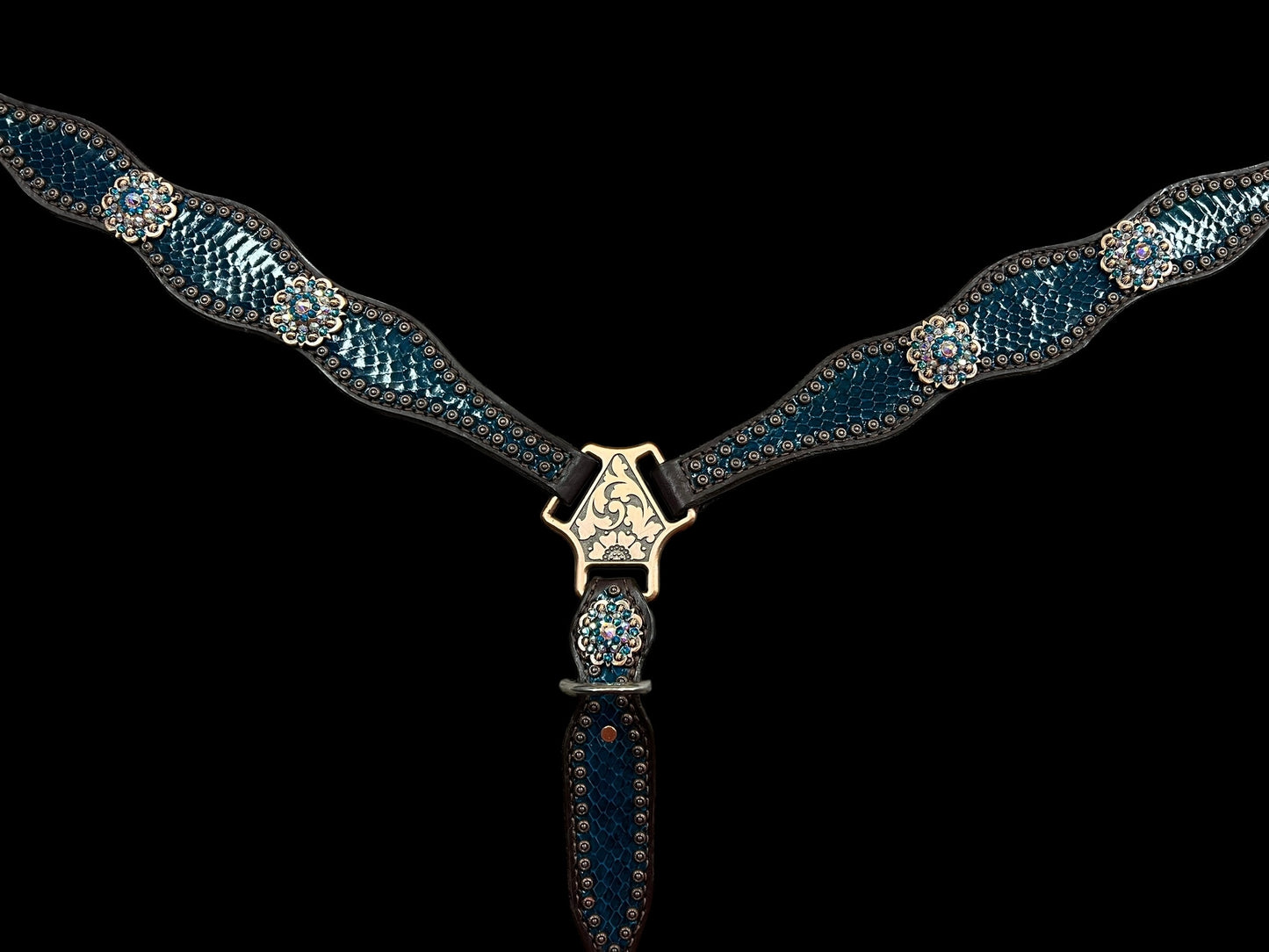 Teal snake on dark leather