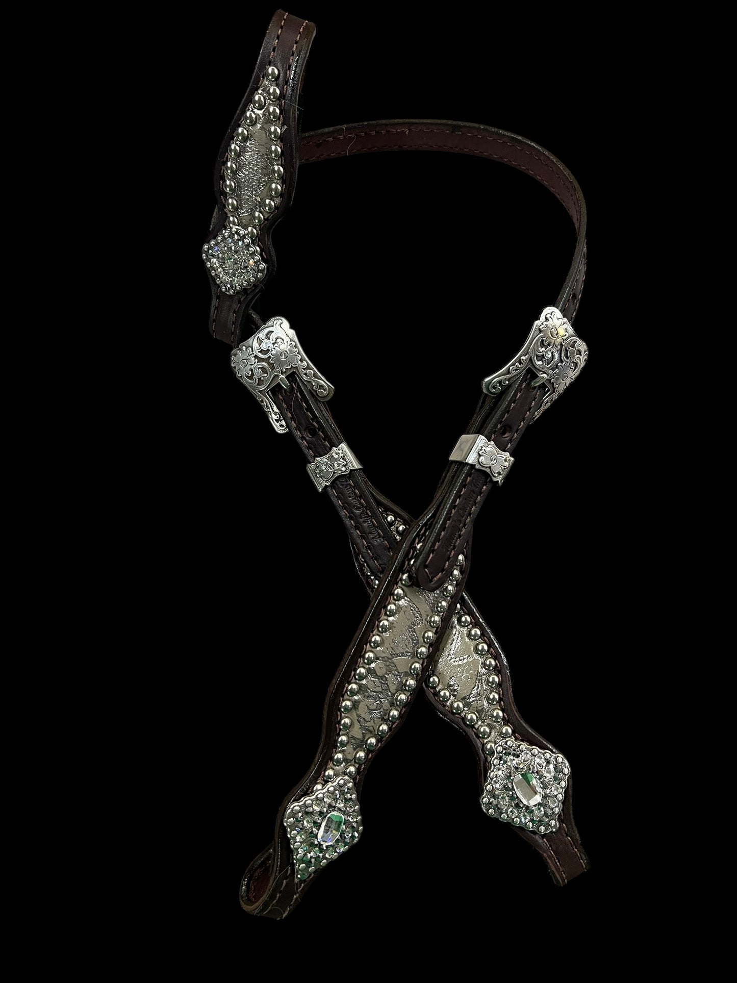 Silver snake on dark leather