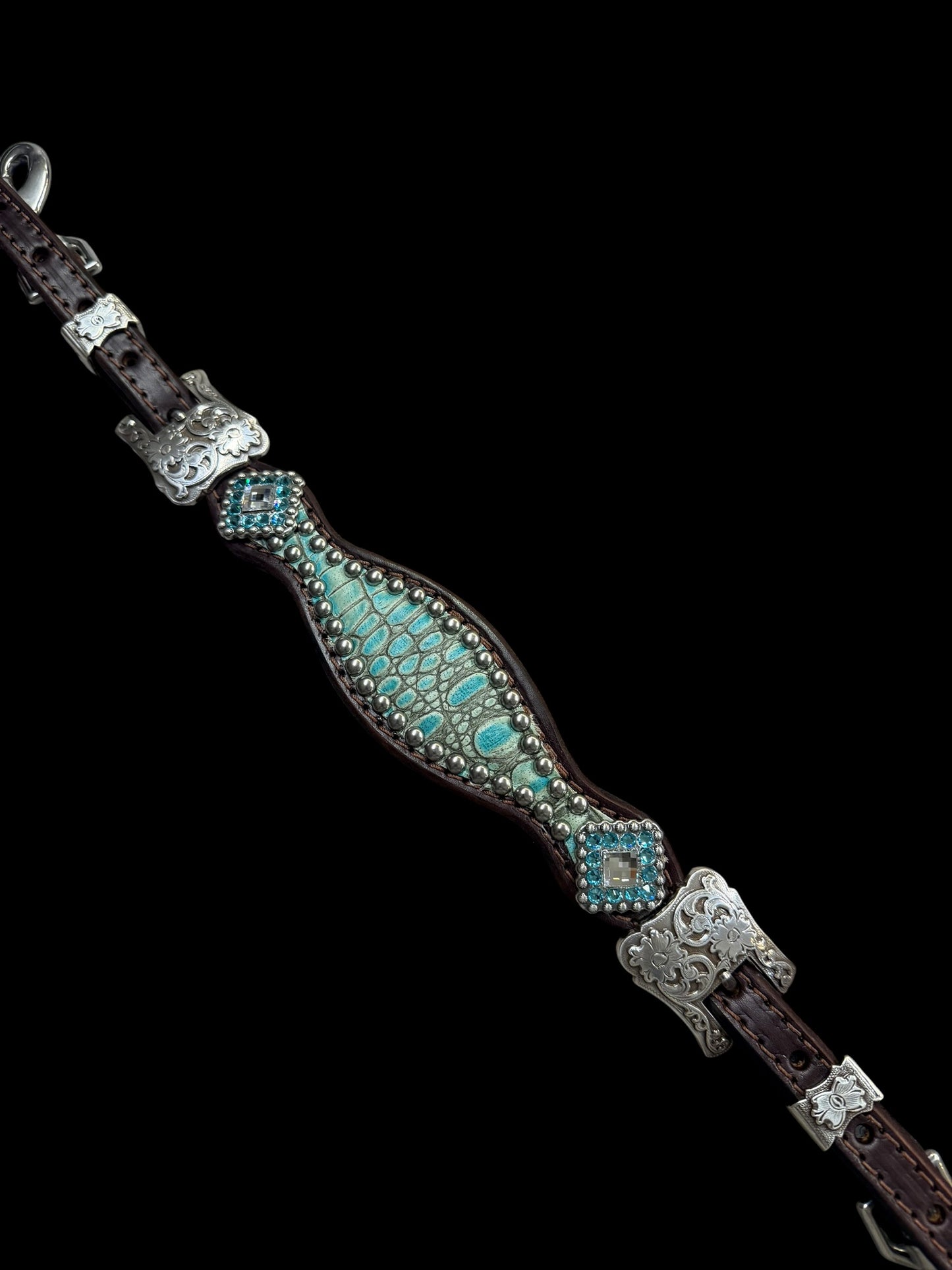 Antique turquoise gator on dark leather