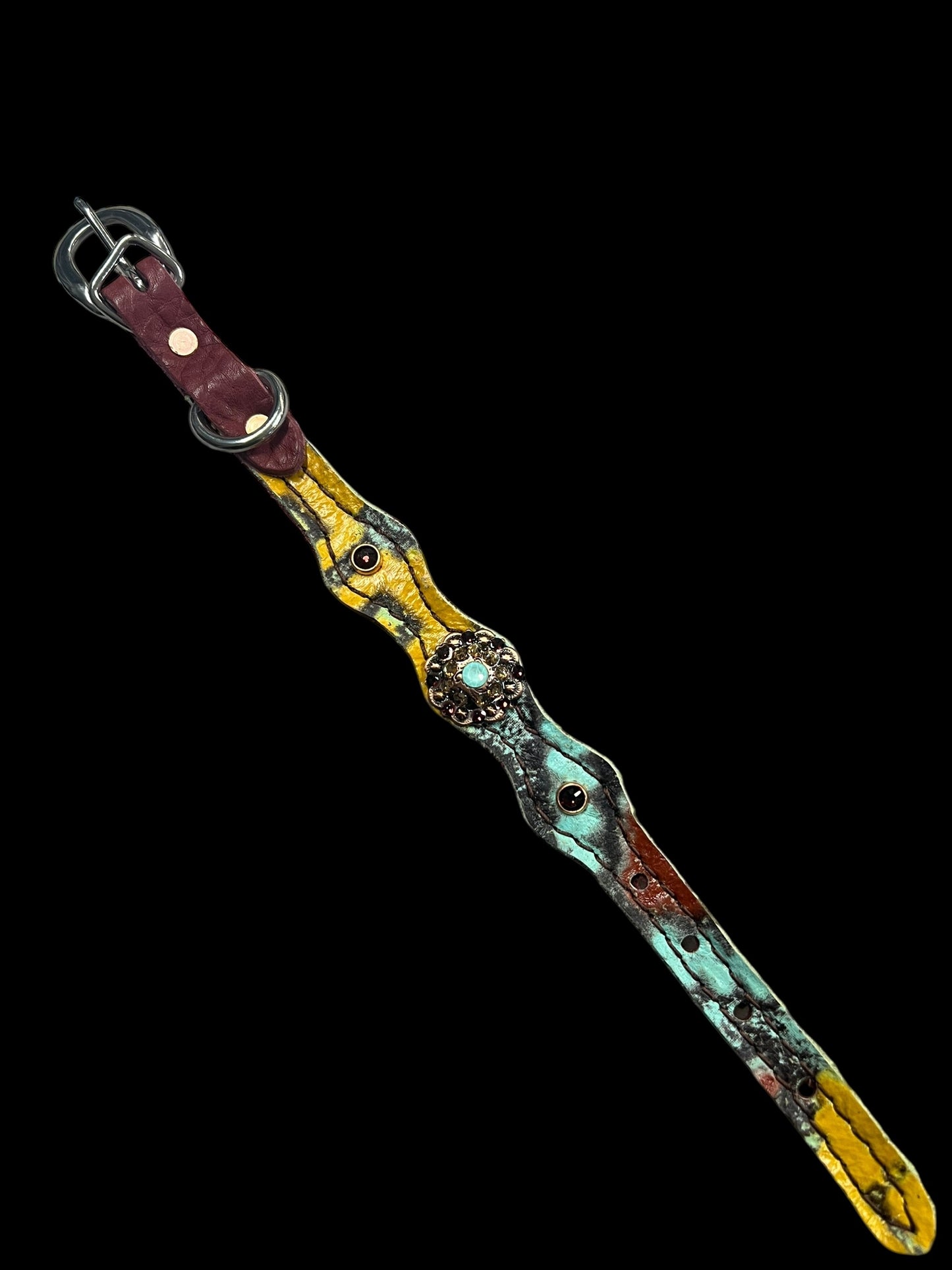 Yellow, mint, and brick red Taos on dark leather