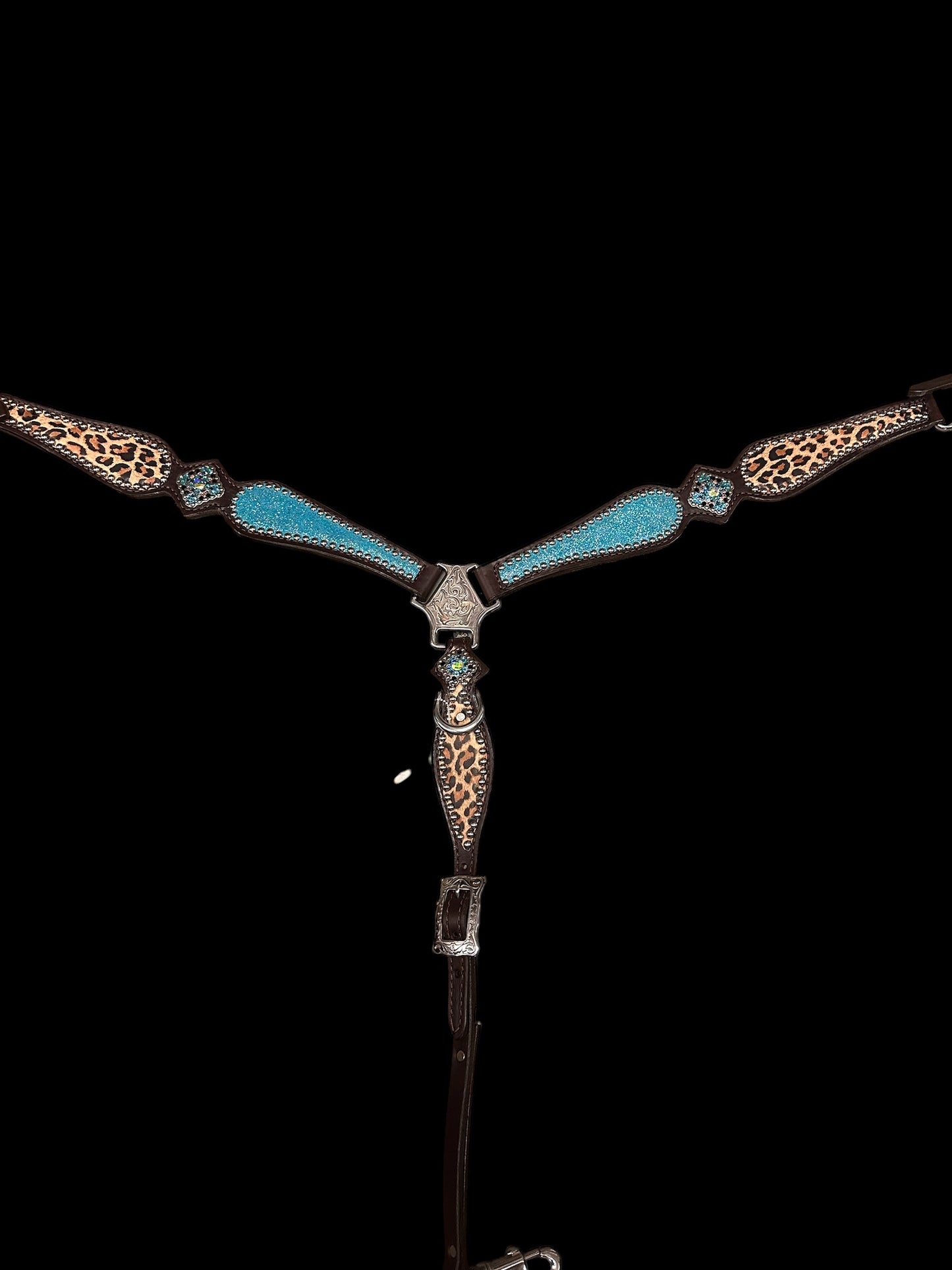 Turquoise sparkle and leopard on dark leather