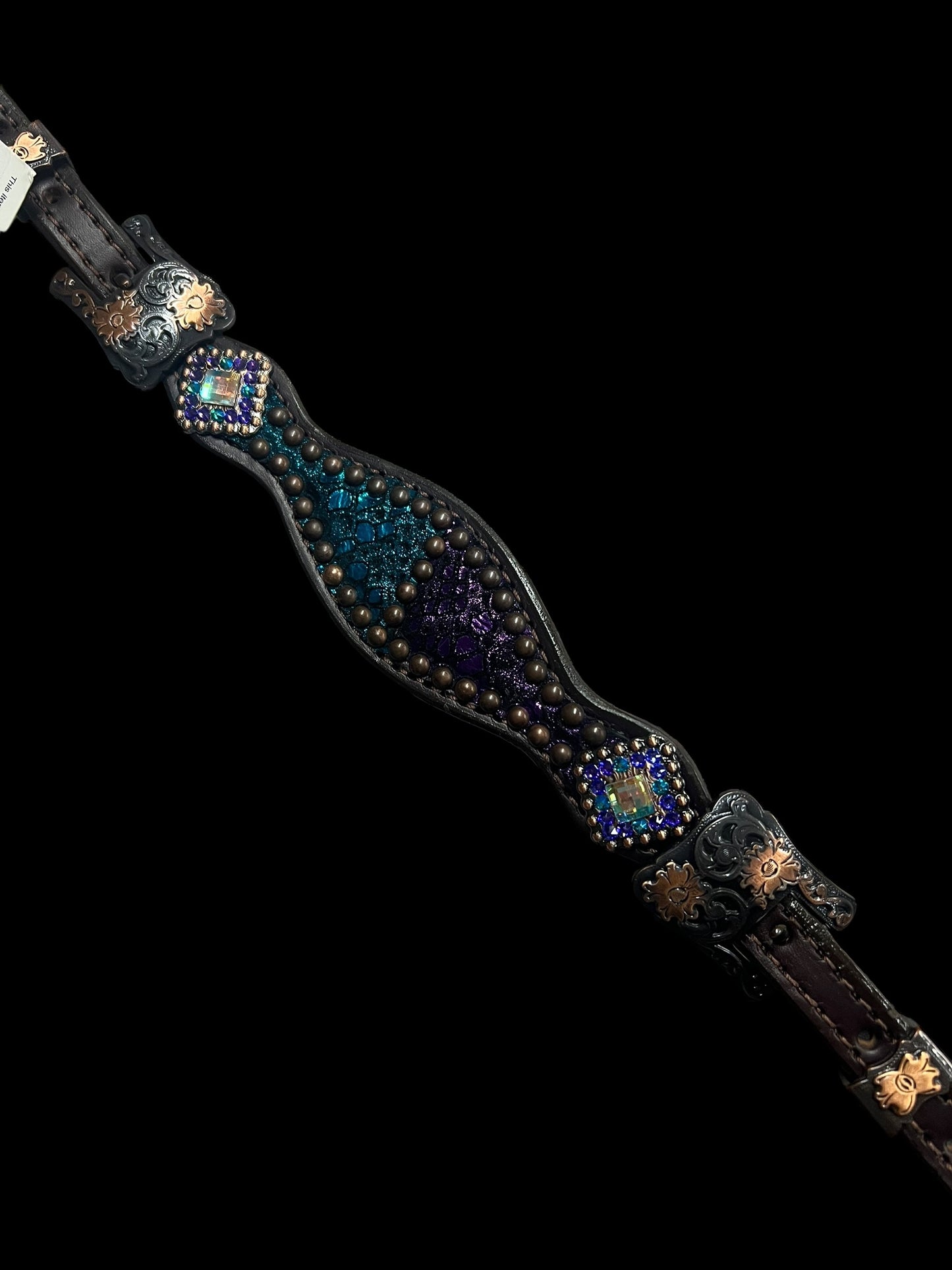 Teal and purple mystic on dark leather