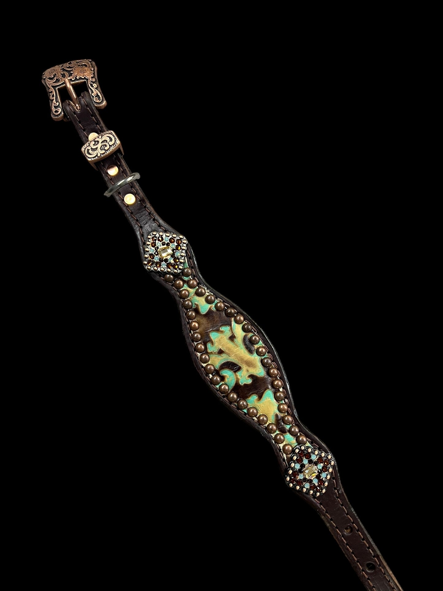 Brown and turquoise corona on dark leather