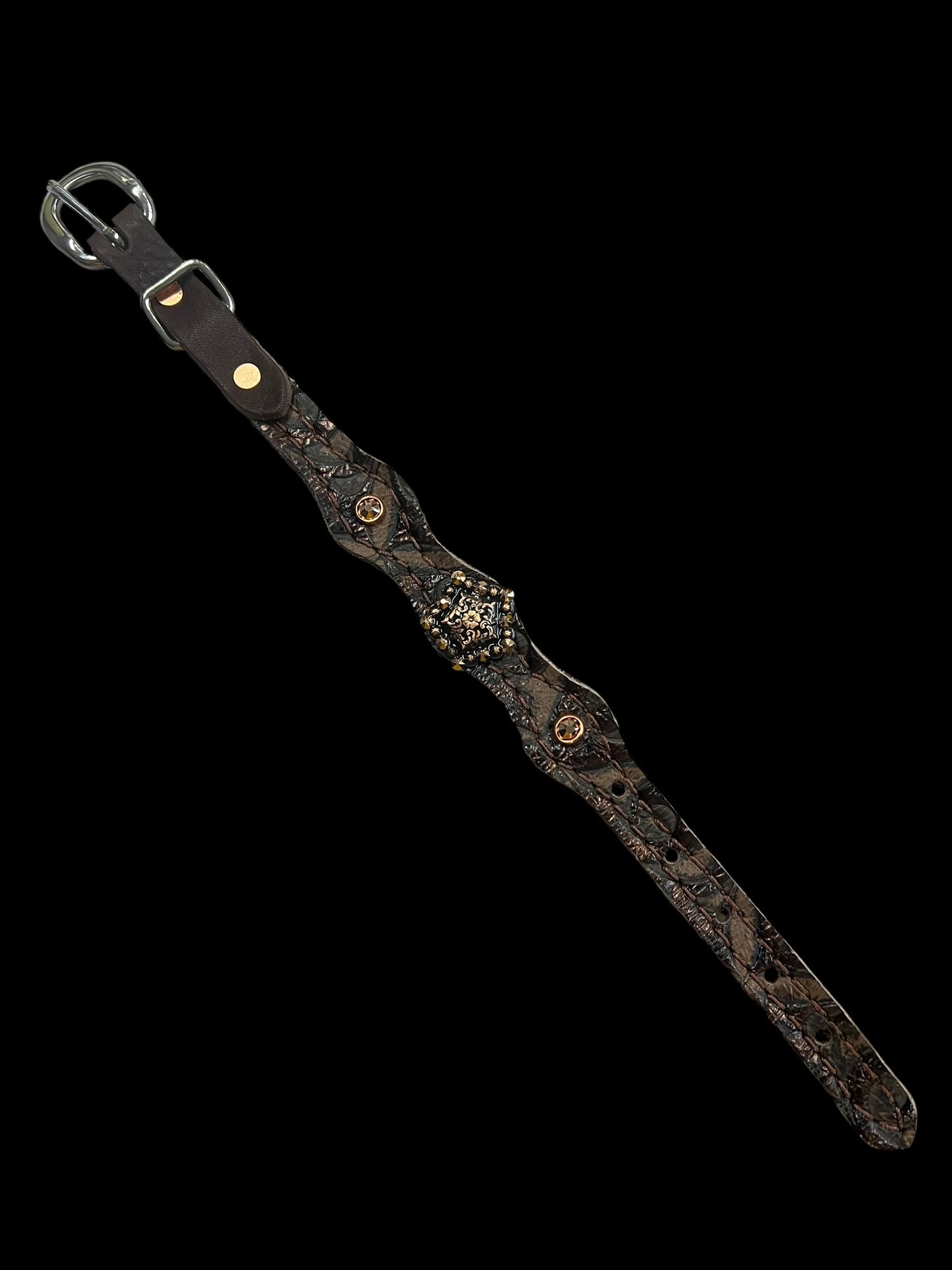 Brown swirl on dark leather