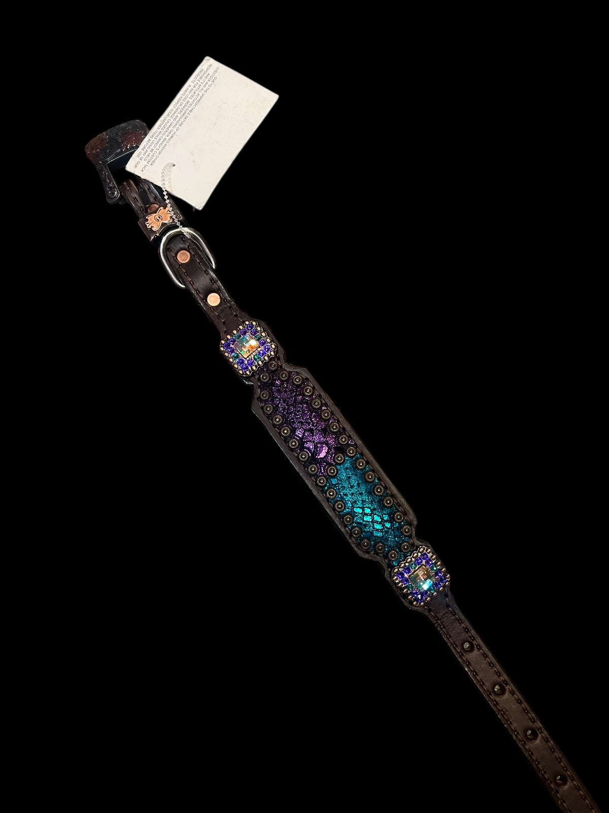 Teal and purple mystic on dark leather