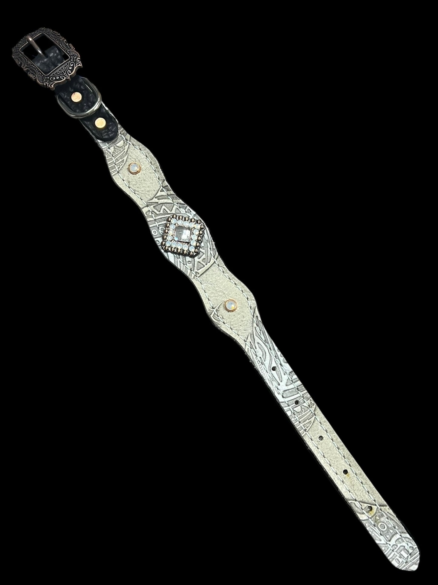 Cream feathers on dark leather