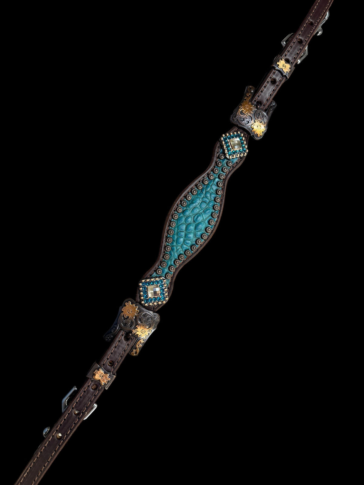 Teal gator on dark leather