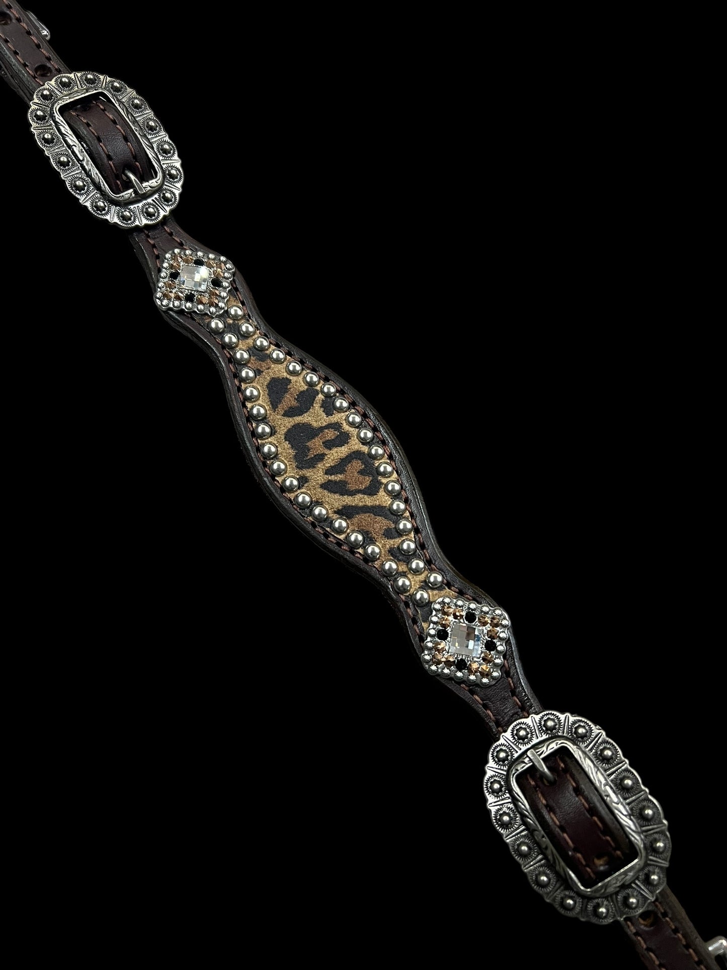 Leopard on dark leather