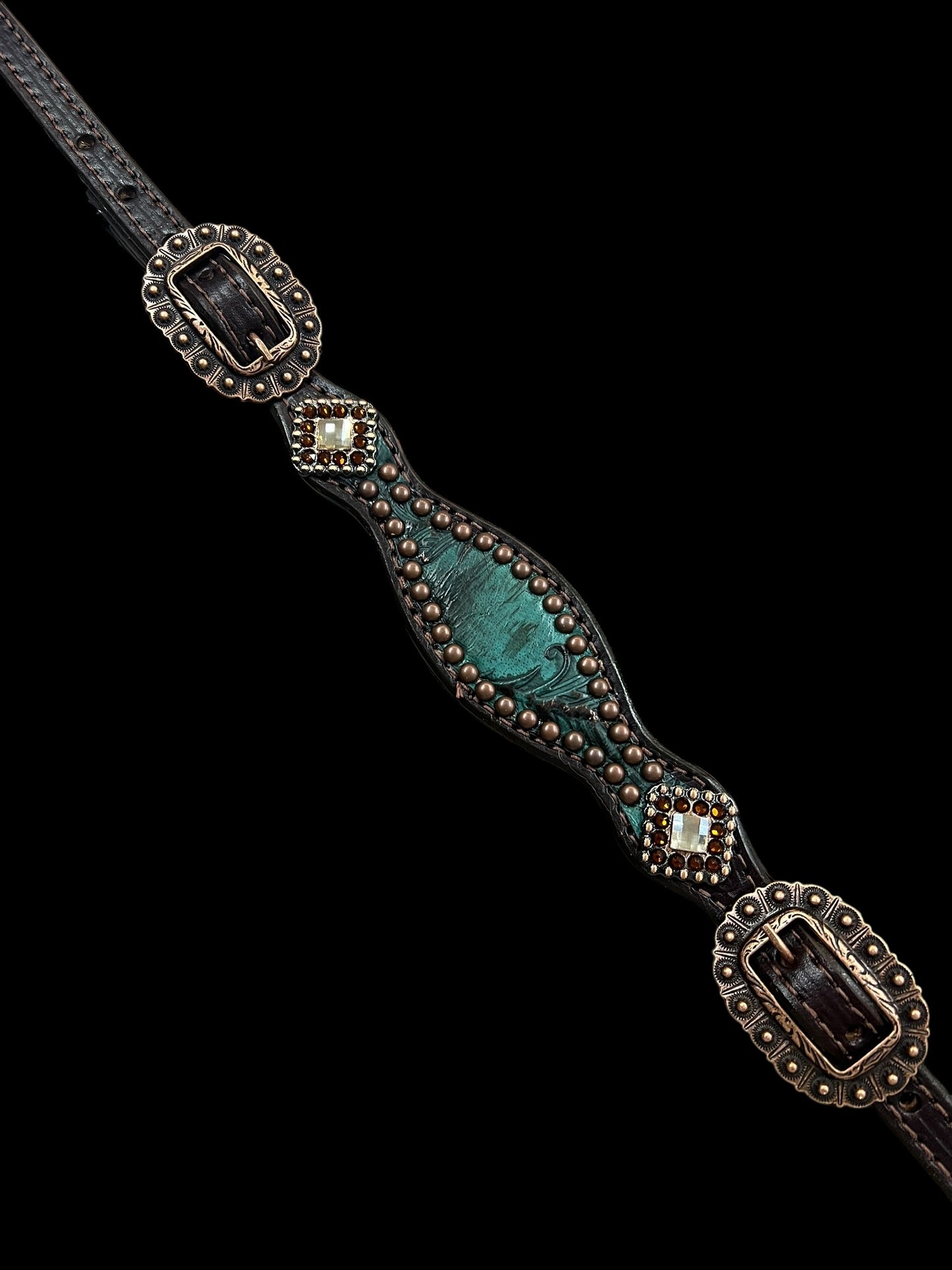 jade feathers on dark leather