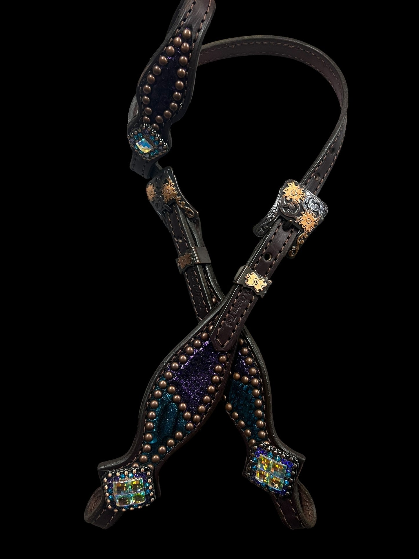 Teal and purple mystic on dark leather