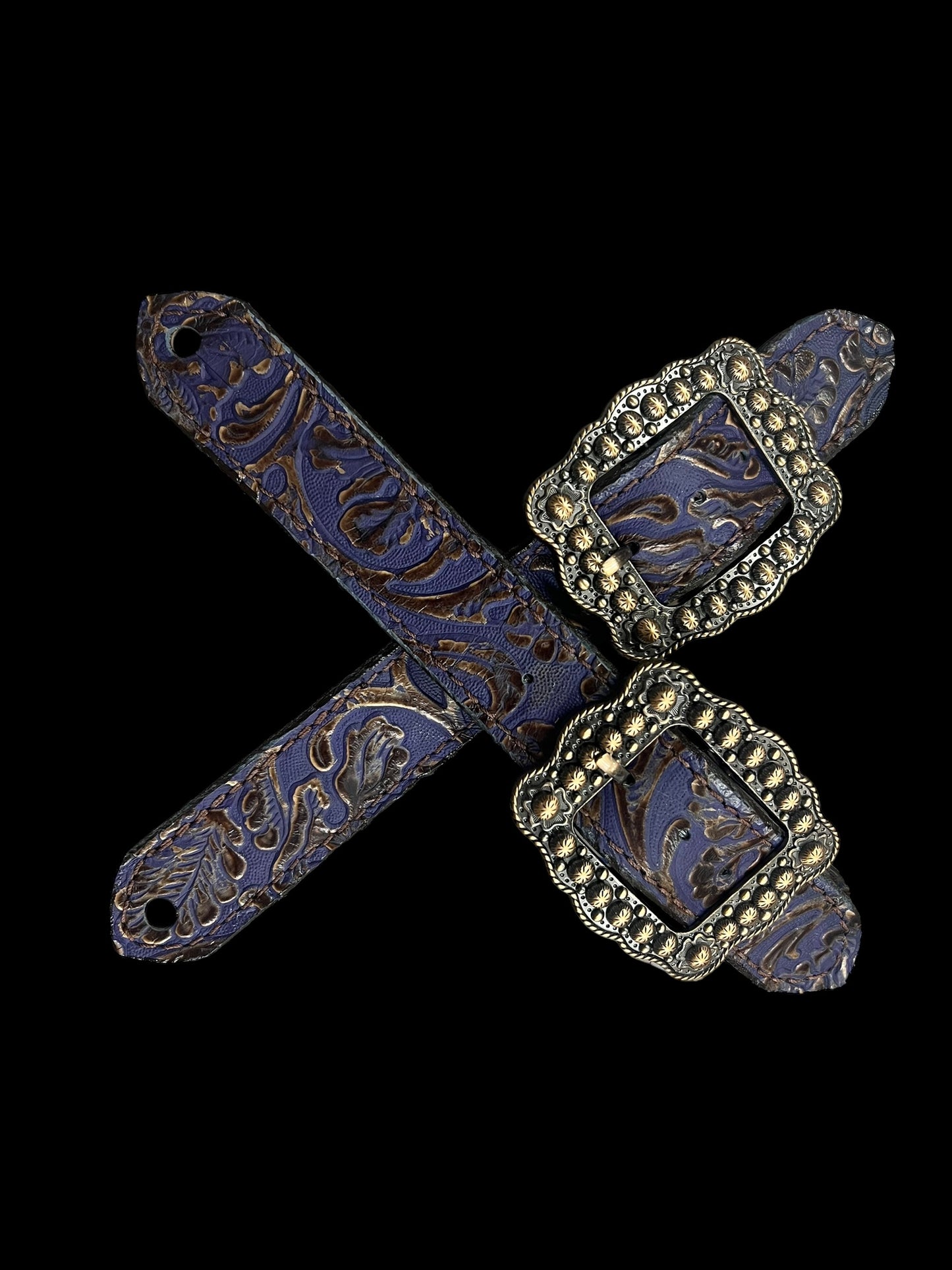 Purple and brown cowboy tool on chocolate leather