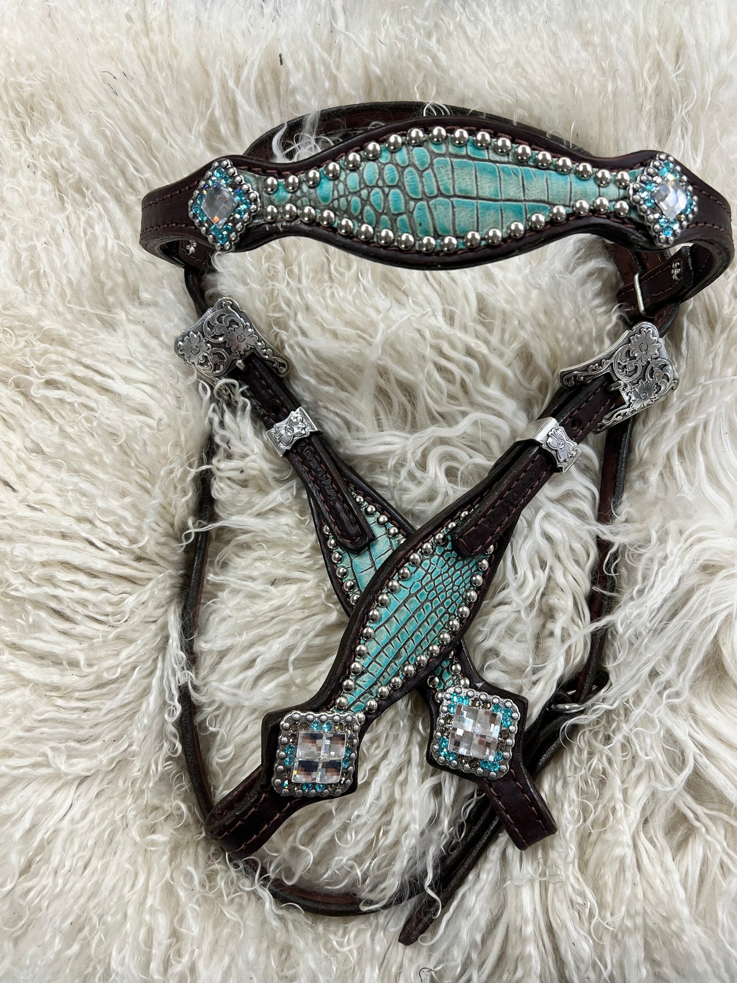 Antique turquoise gator on dark leather