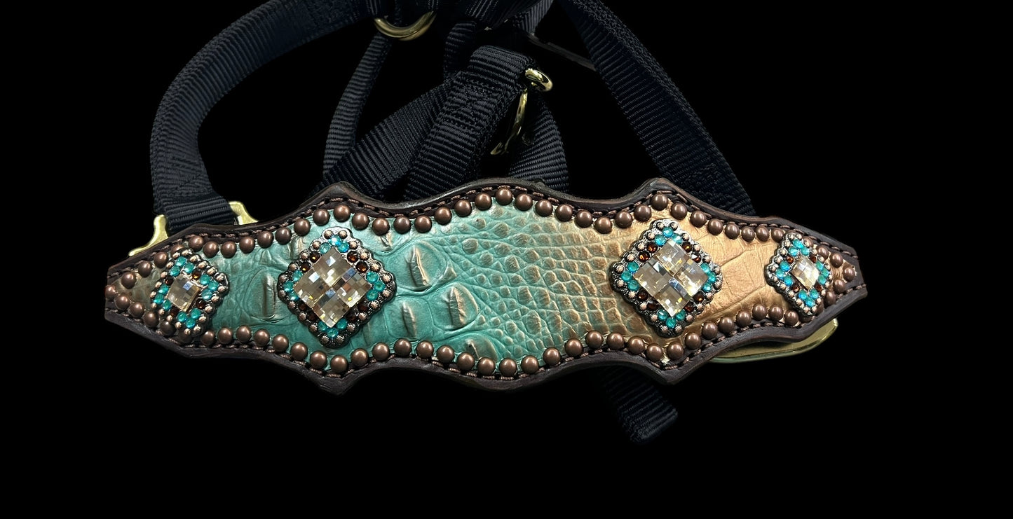 Brown and teal gator on dark leather