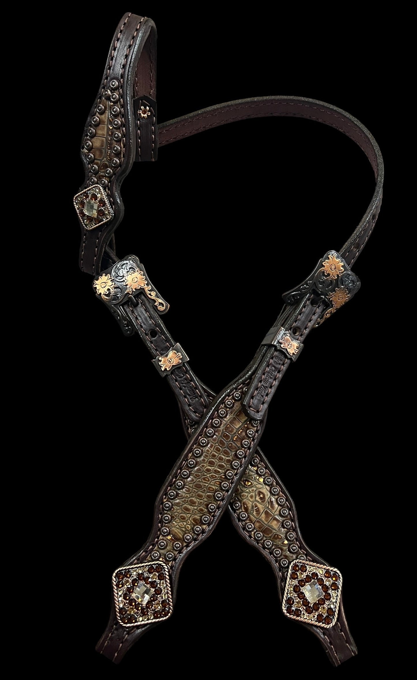 Copper gator on dark leather