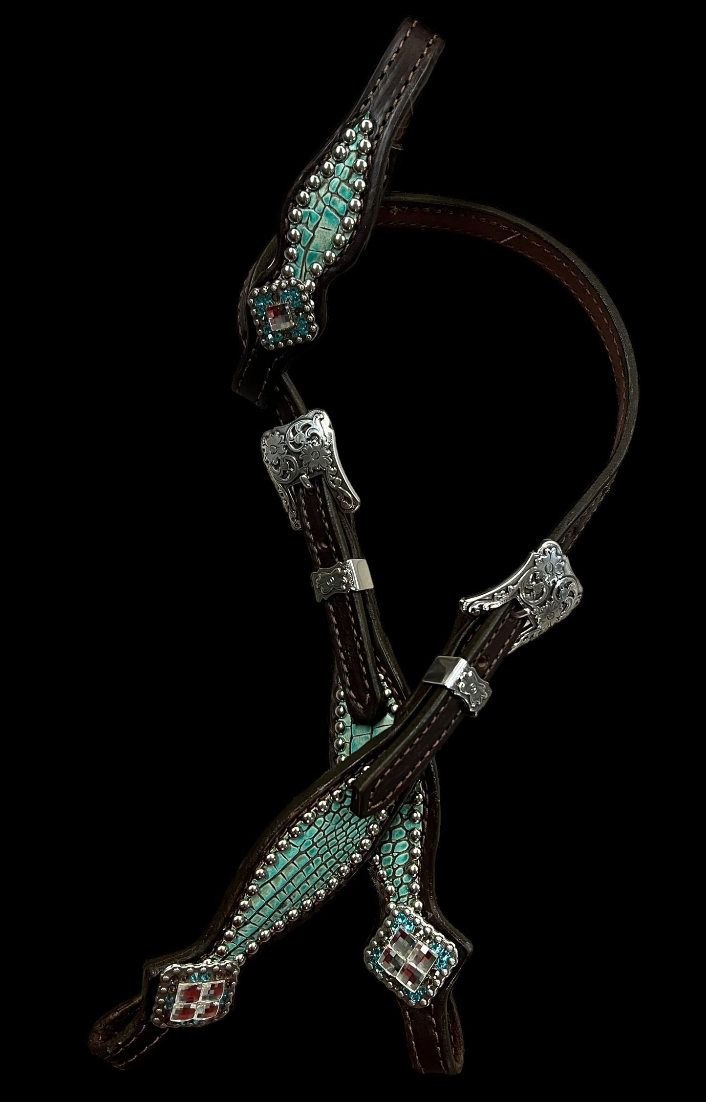 Antique turquoise gator on dark leather