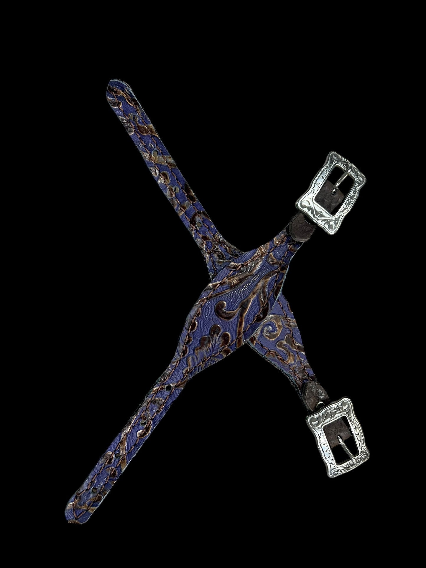 Purple and brown cowboy tool on chocolate leather