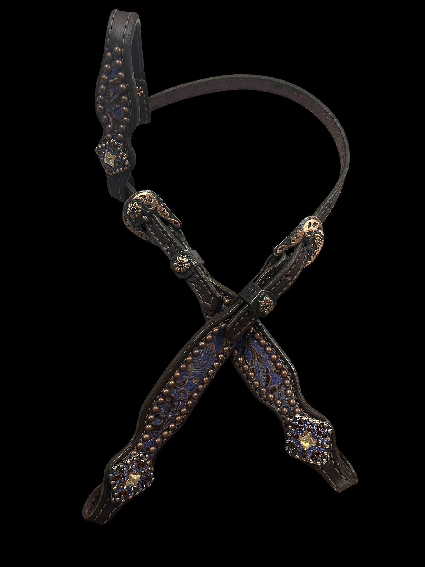 Purple and brown cowboy tool on chocolate leather