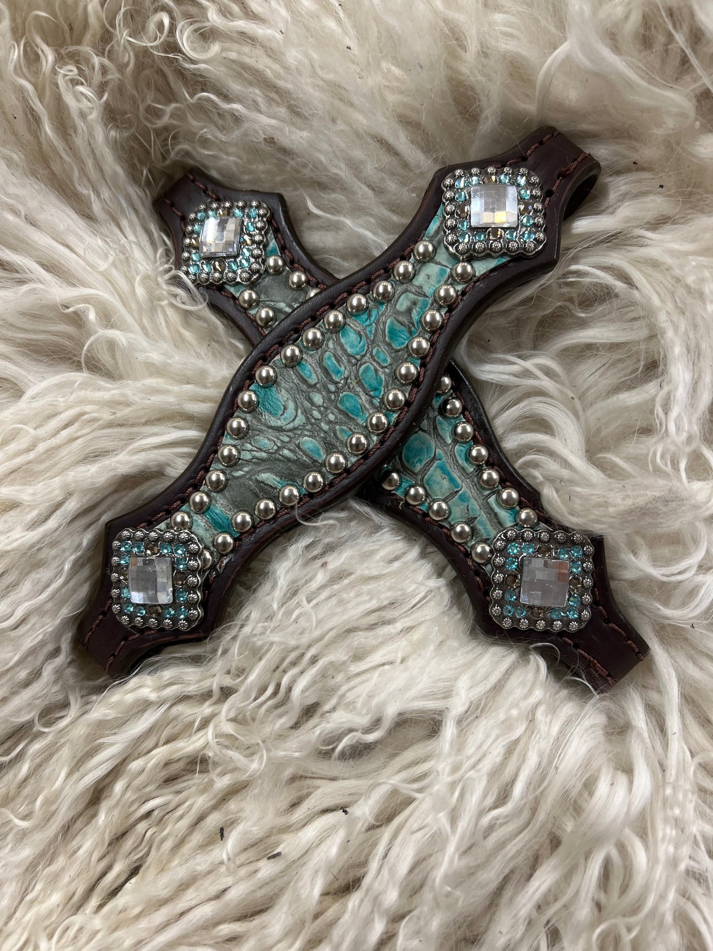 Antique turquoise gator on dark leather