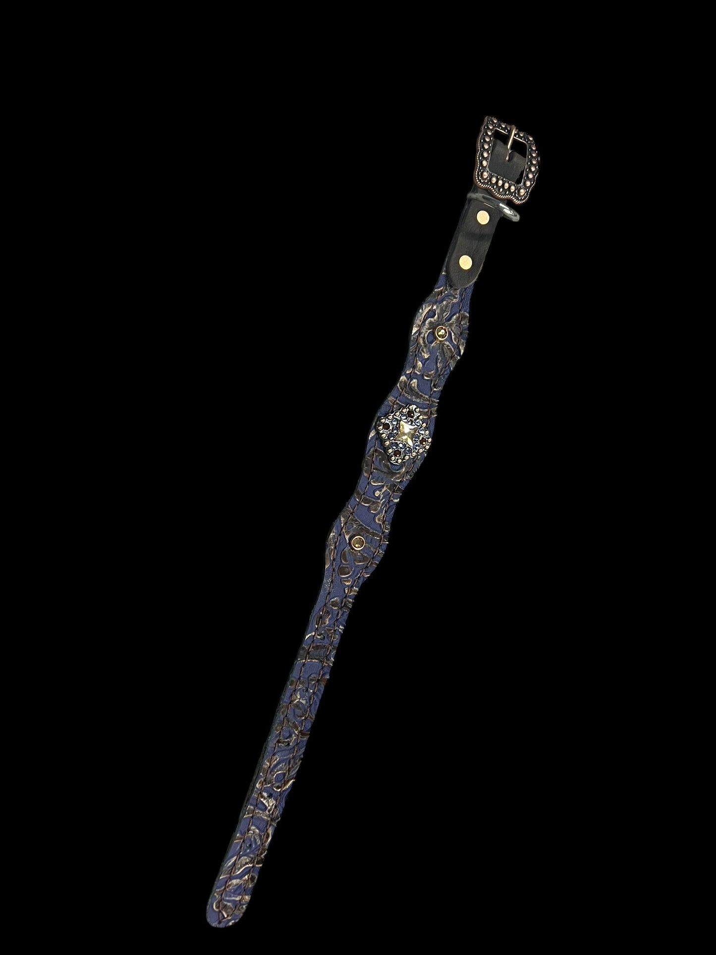 Purple and brown cowboy tool on chocolate leather