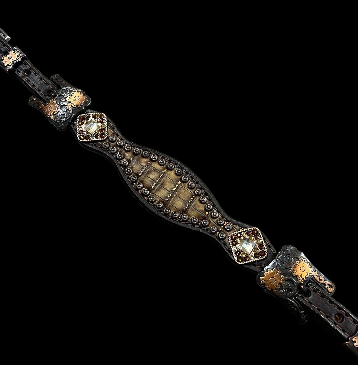 Copper gator on dark leather