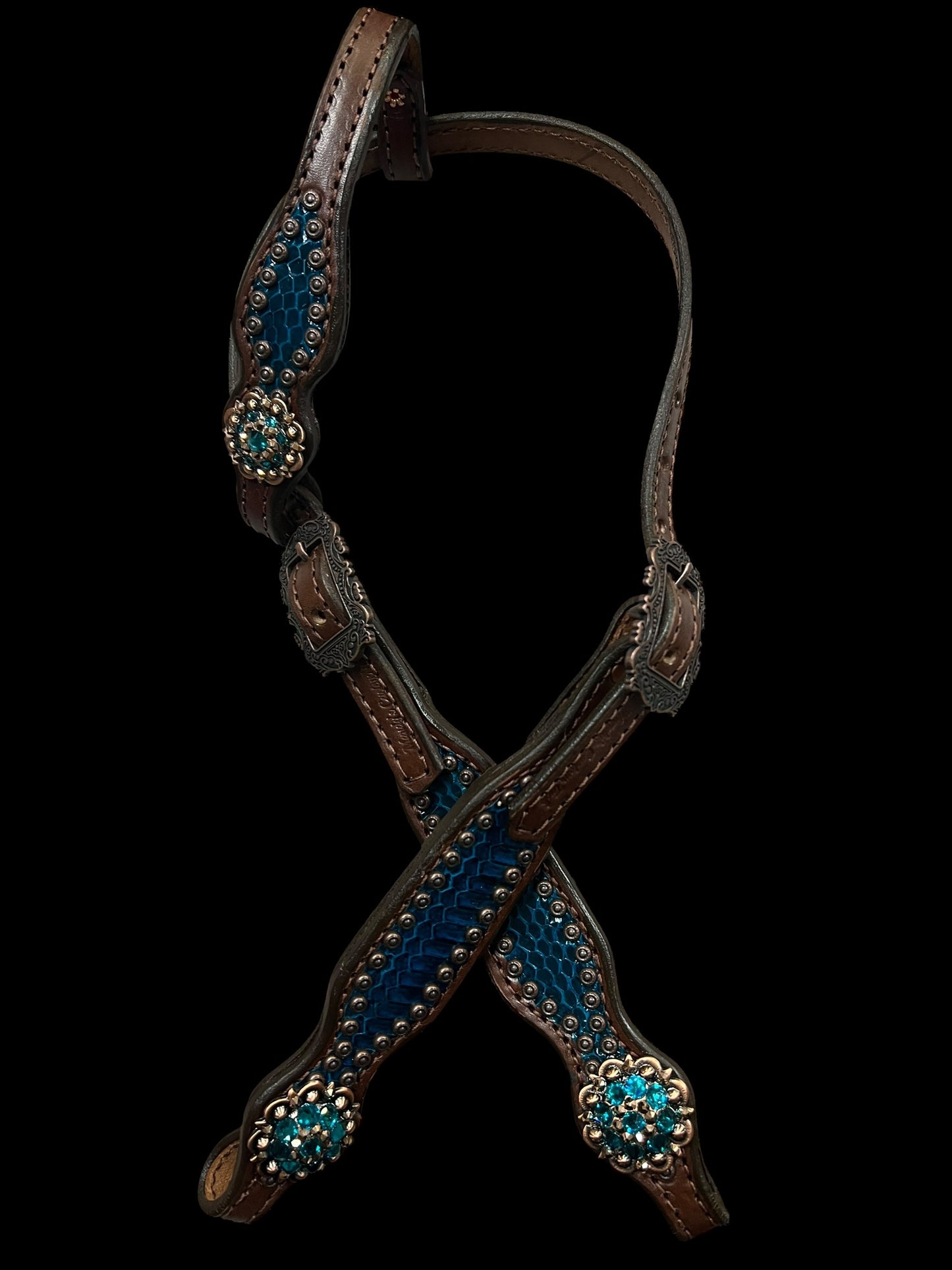 Teal snake on walnut leather