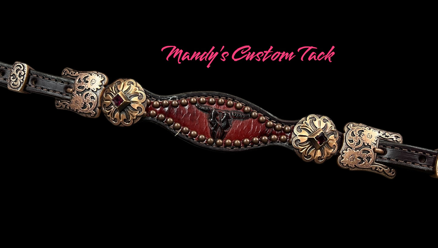 Red longhorns on dark leather