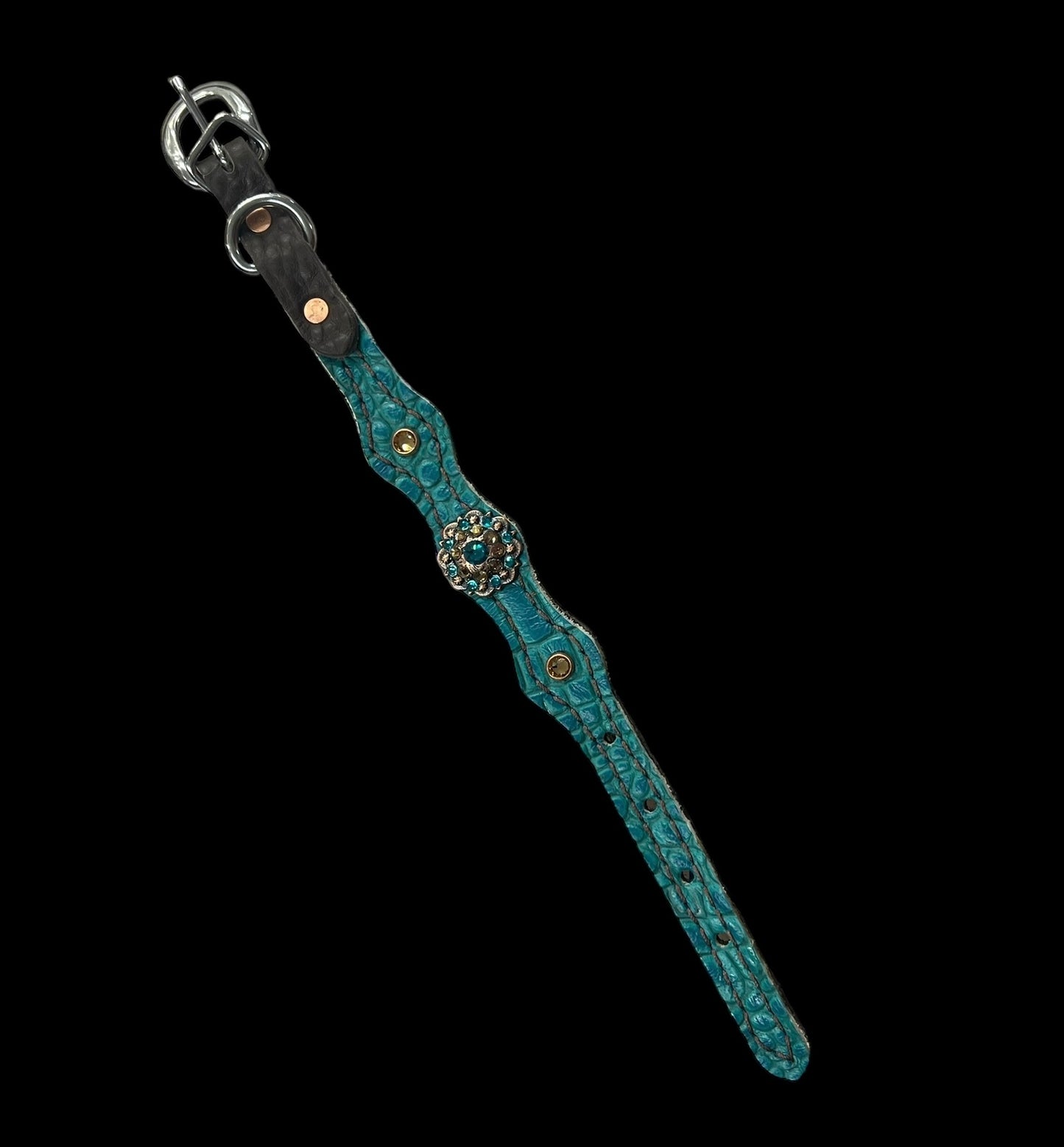 Teal gator on dark leather