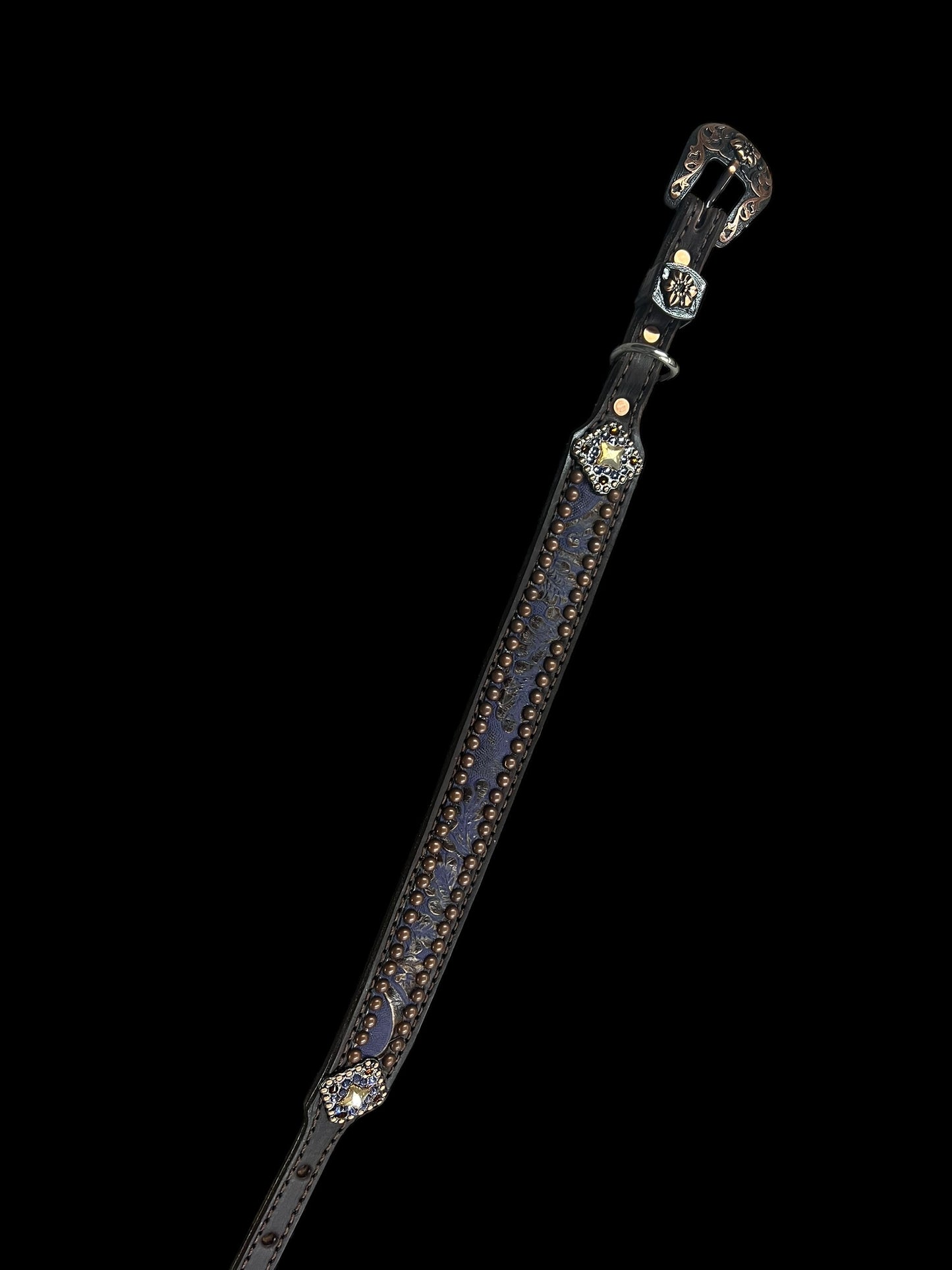 Purple and brown cowboy tool on chocolate leather