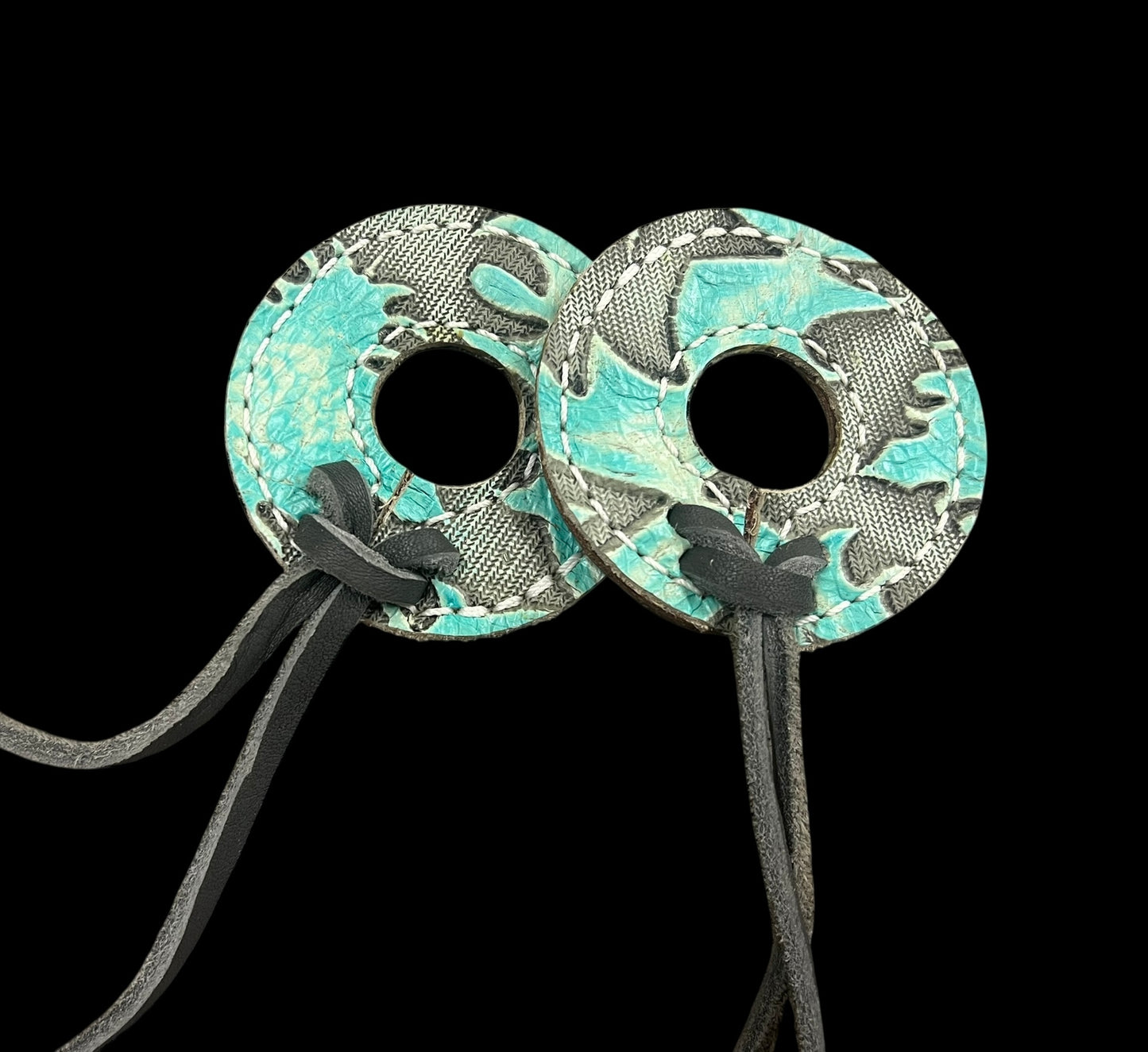 Light turquoise Laredo on dark leather