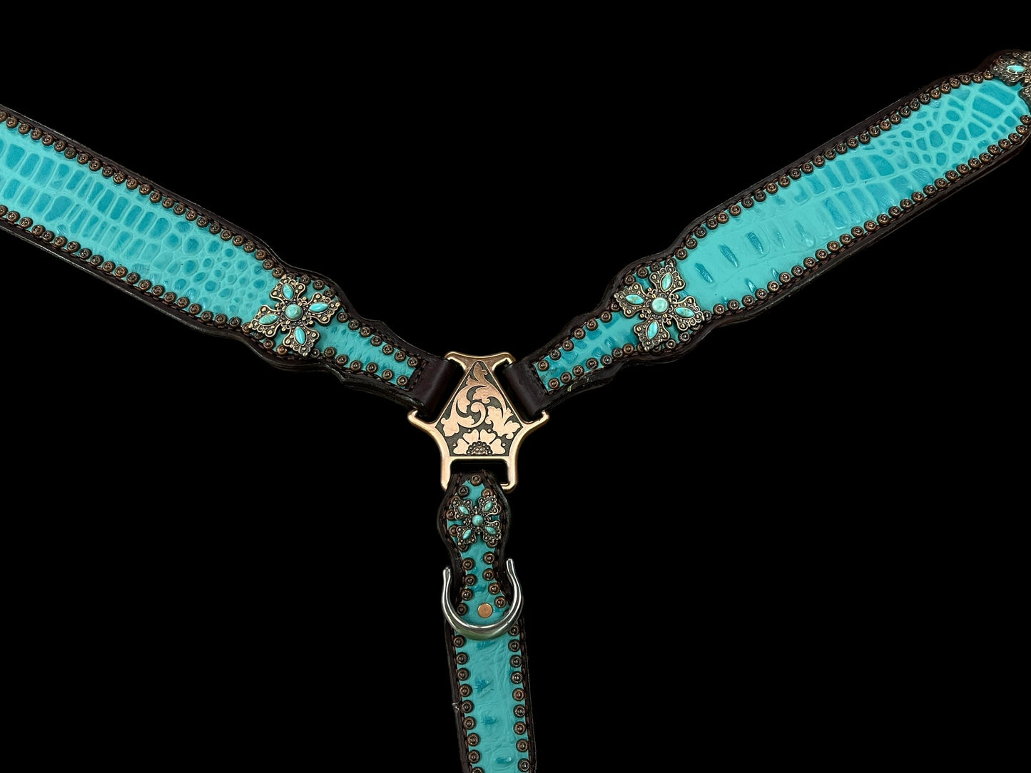 Turquoise gator on dark leather