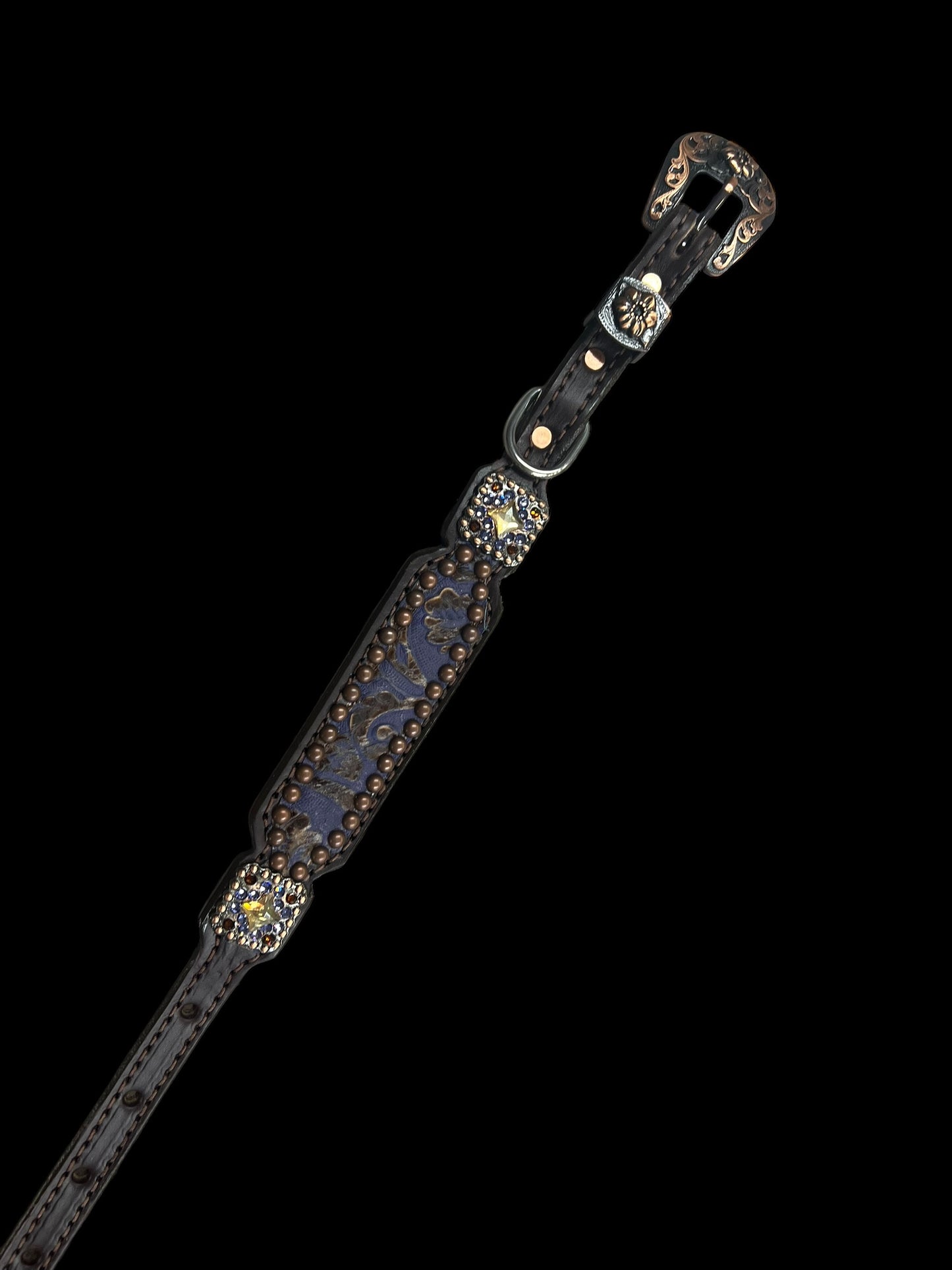 Purple and brown cowboy tool on chocolate leather