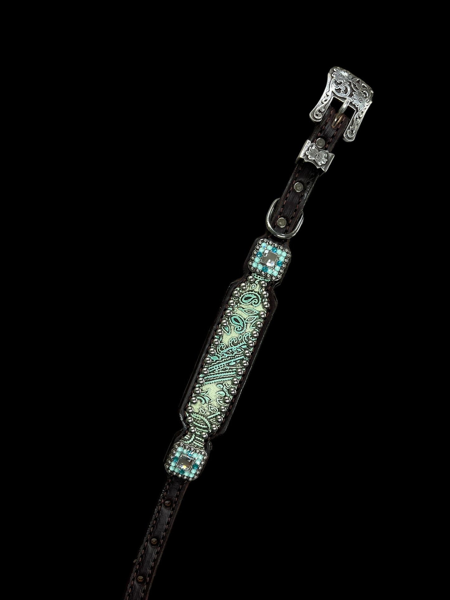 Turquoise and mint paisley on dark leather is