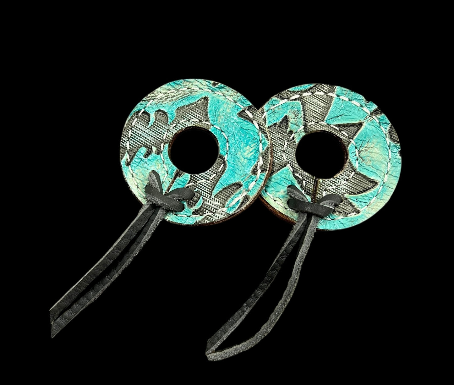 Light turquoise Laredo on dark leather