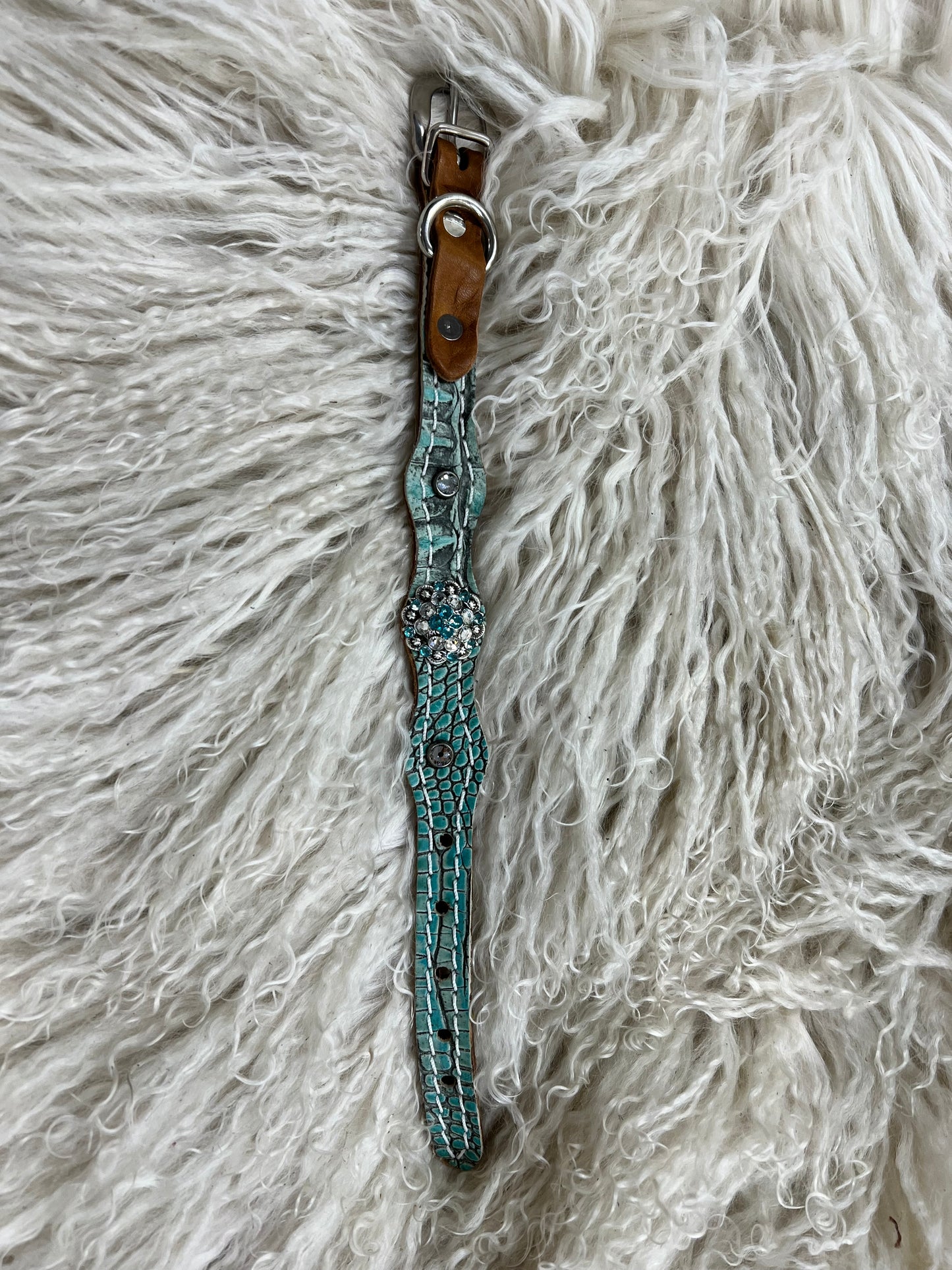 Antique turquoise gator on dark leather