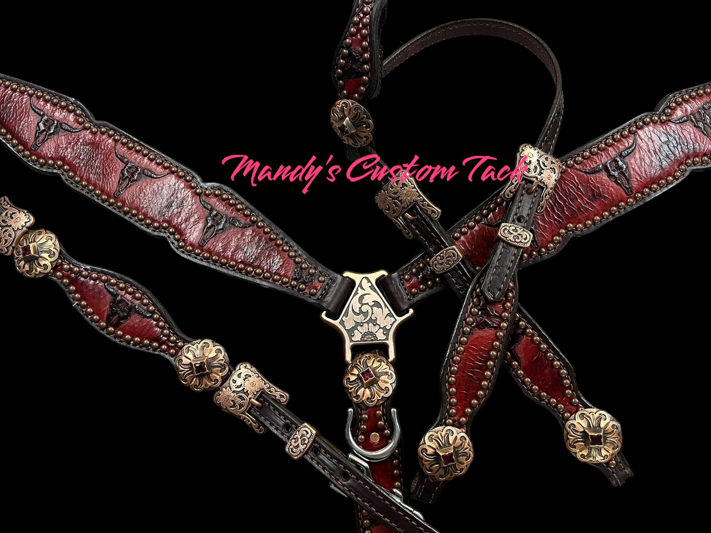 Red longhorns on dark leather