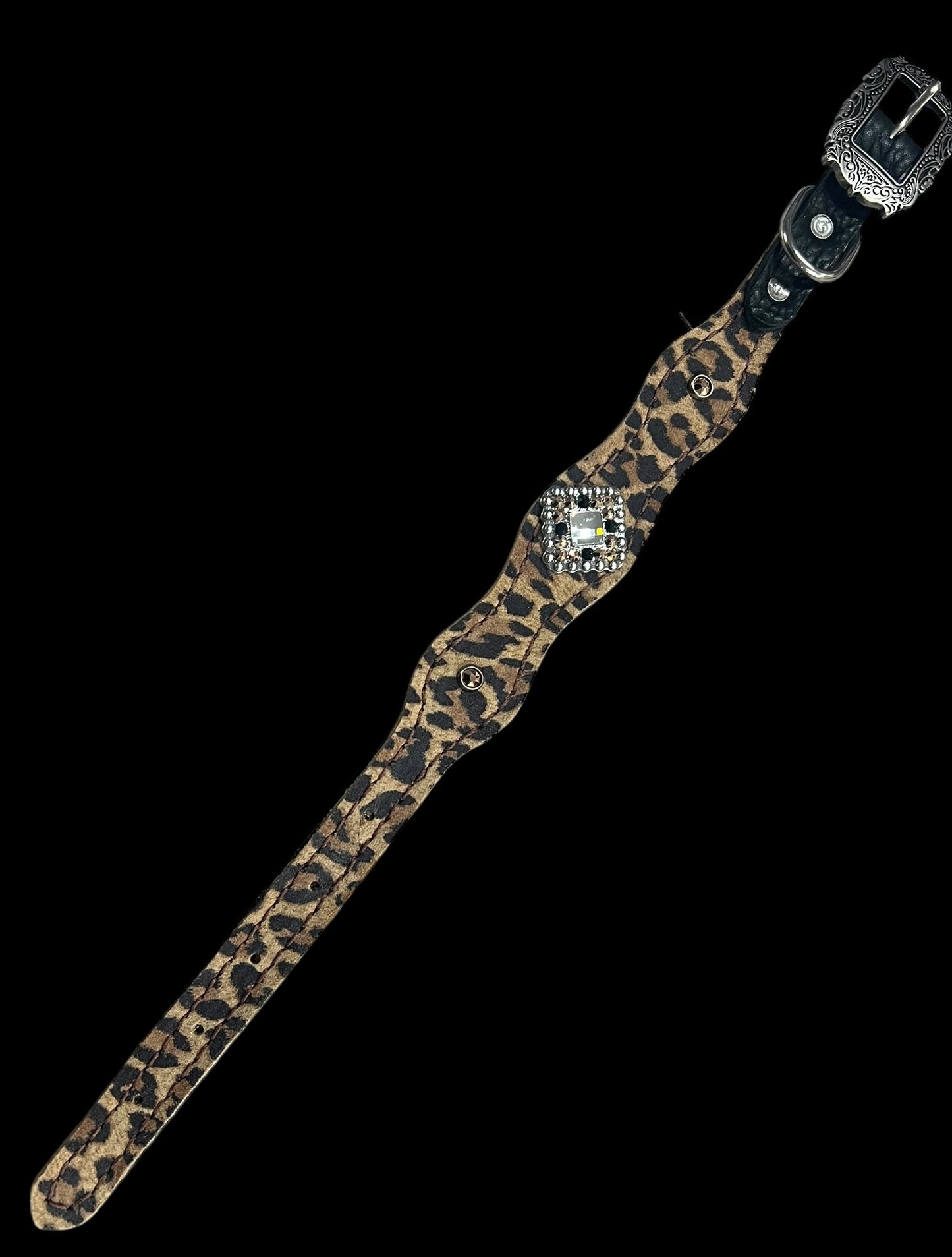 Leopard on dark leather