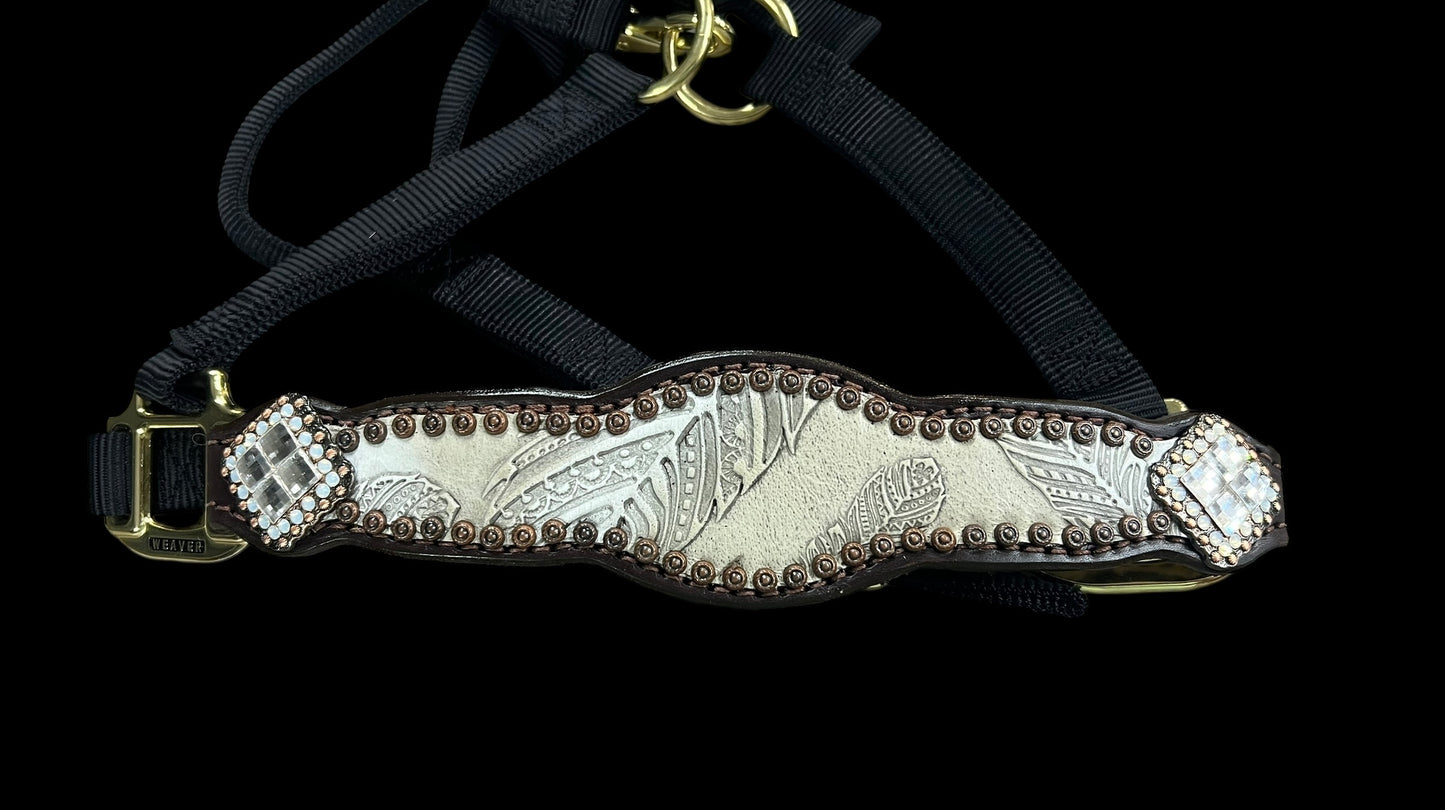 Cream feathers on dark leather