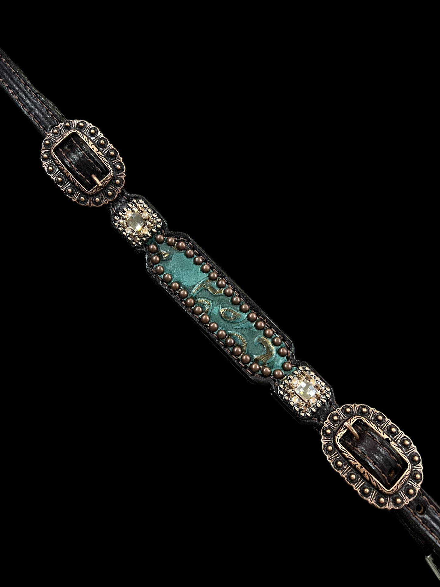 jade and copper on dark leather