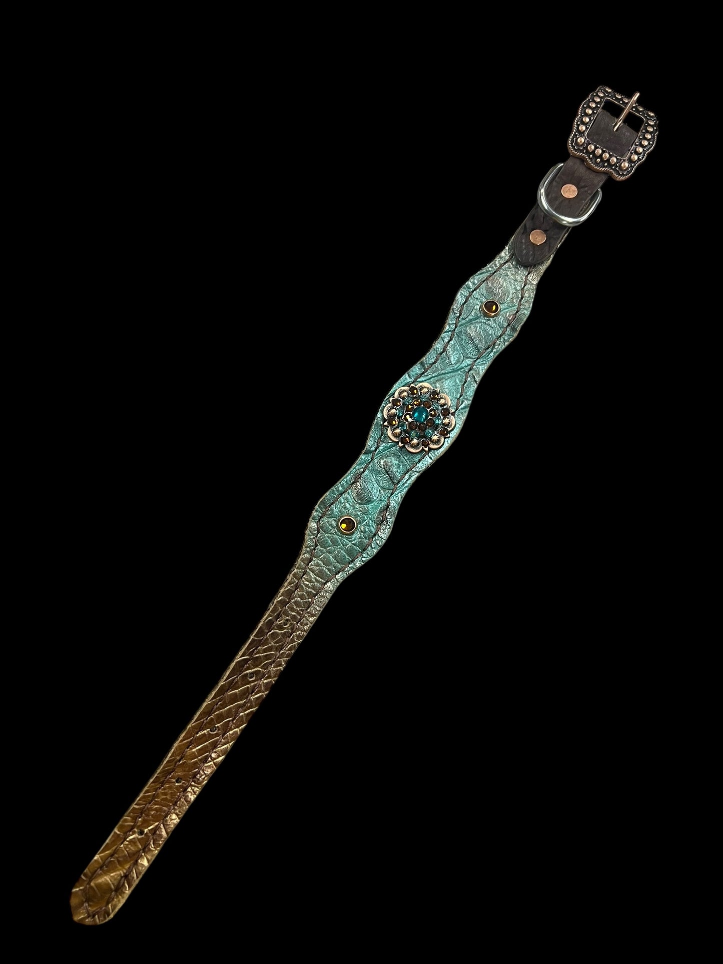 Brown and teal gator on dark leather