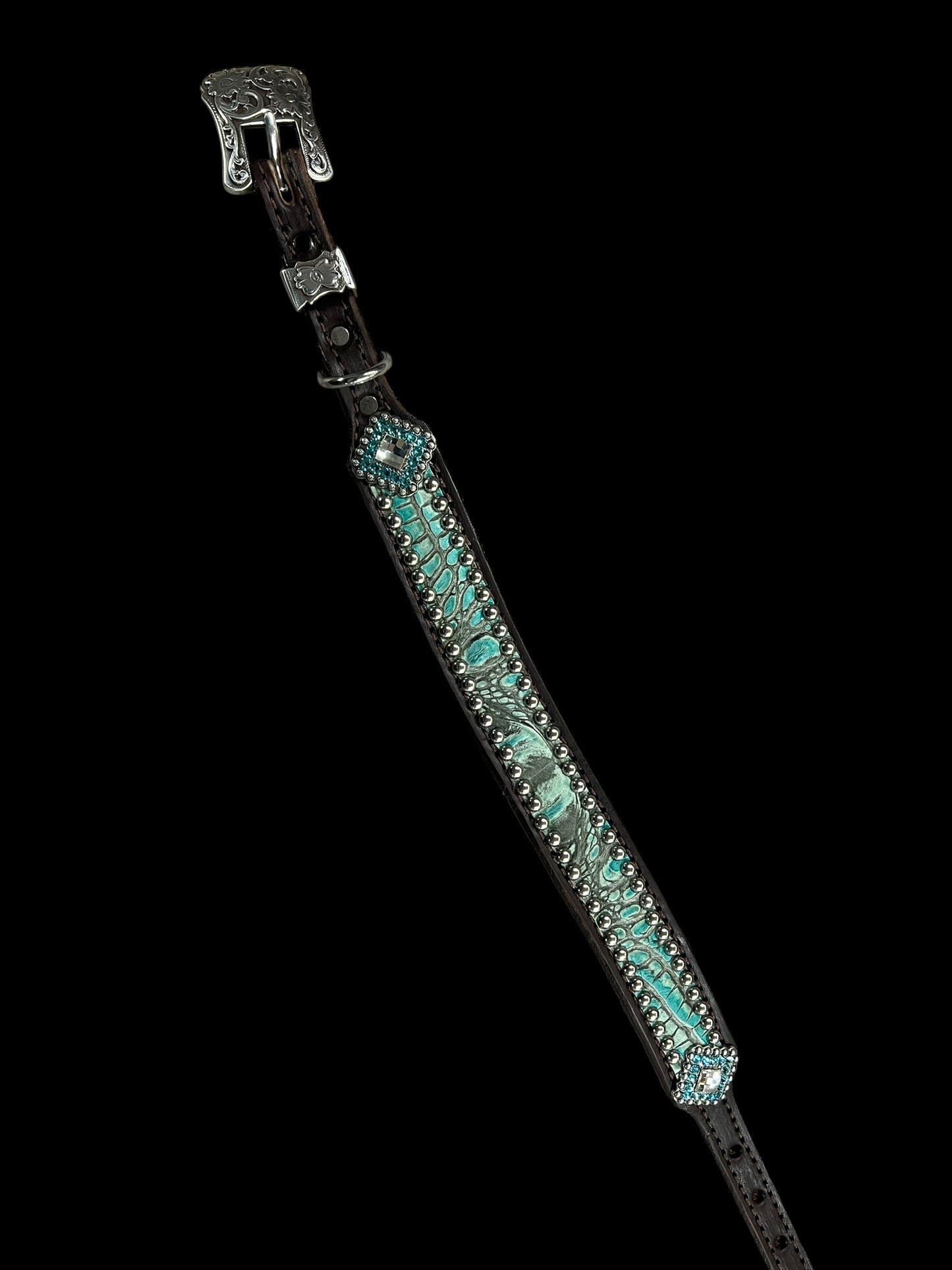 Antique turquoise gator on dark leather