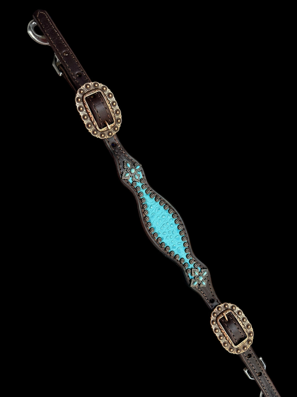 Turquoise gator on dark leather