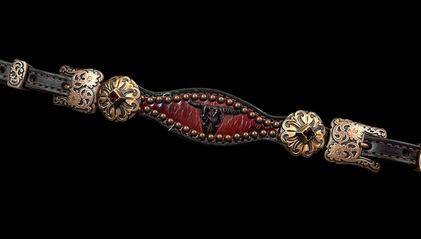 Red longhorns on dark leather