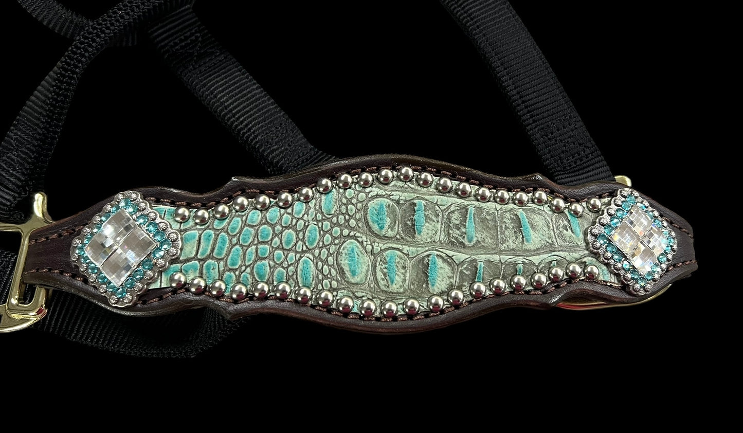 Antique turquoise gator on dark leather