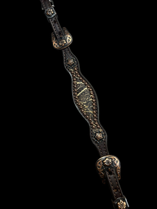 cream and brown daisy on dark leather