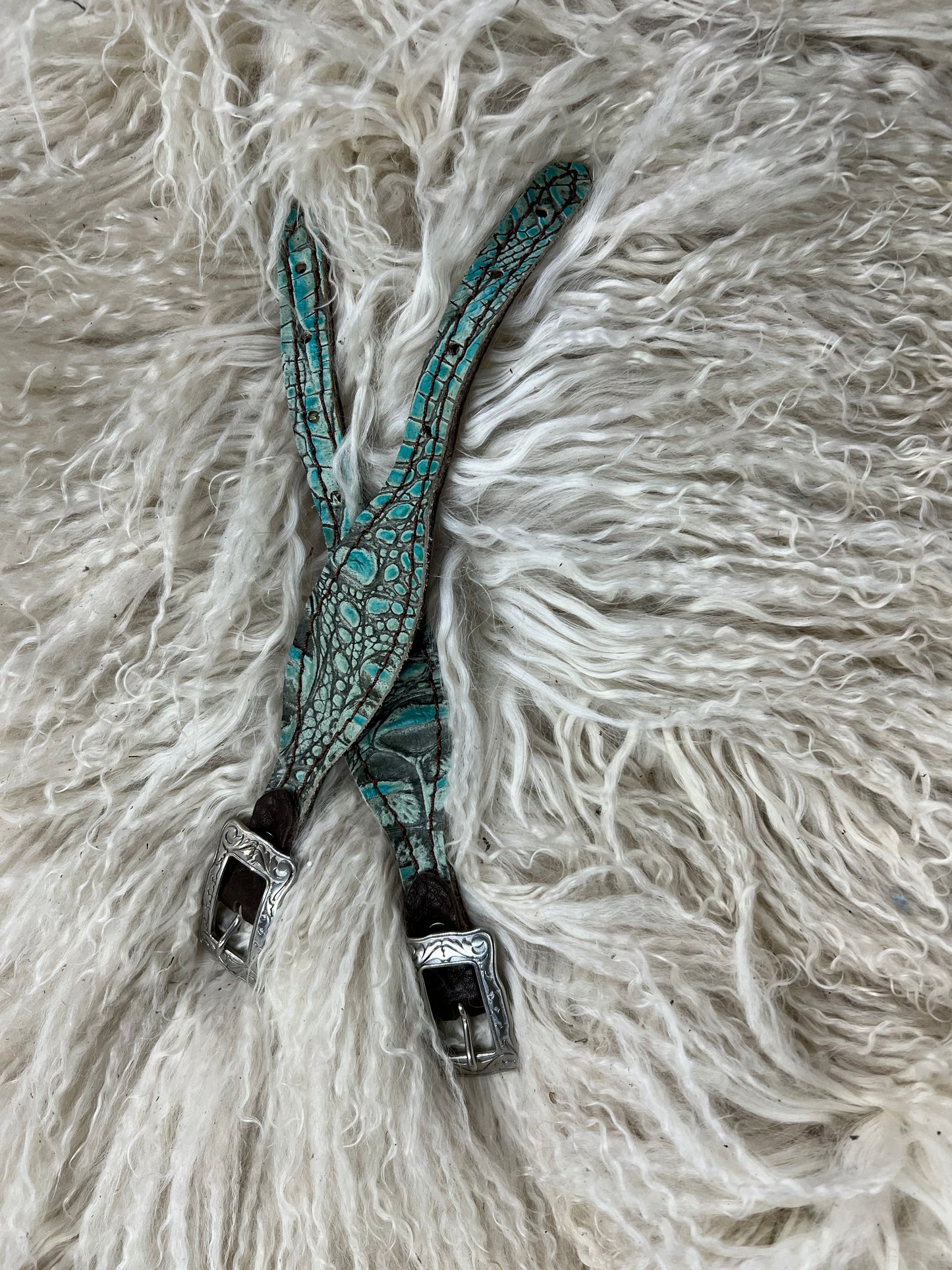 Antique turquoise gator on dark leather