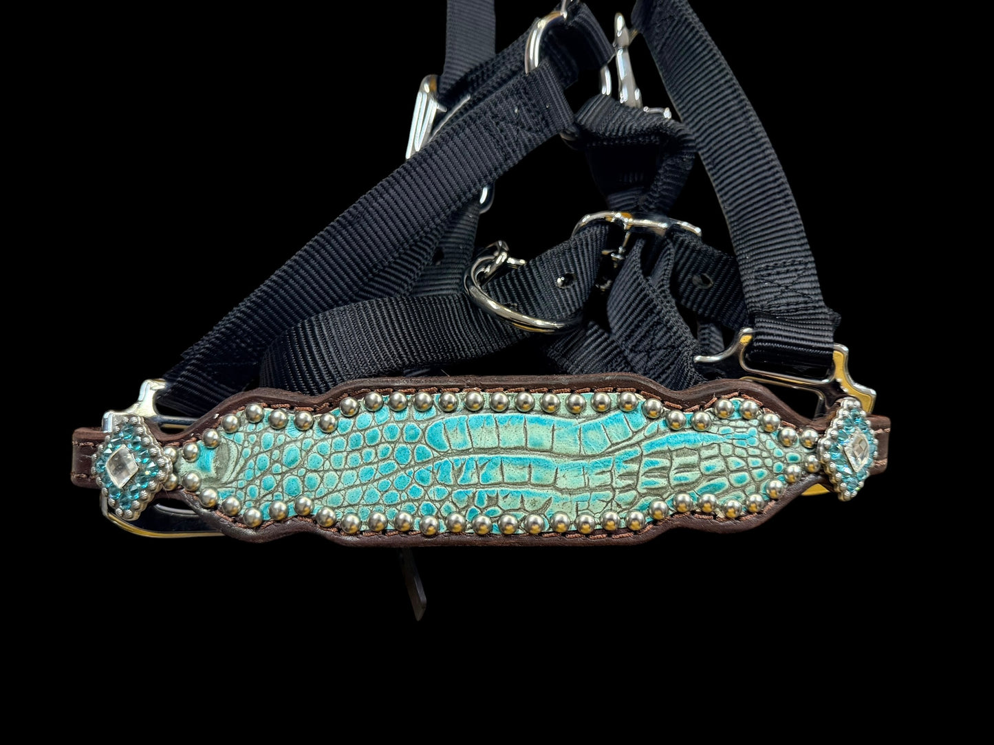 Antique turquoise gator on dark leather