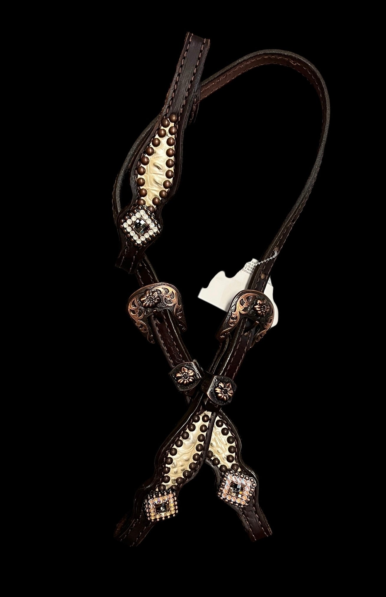 Champagne gator on dark leather