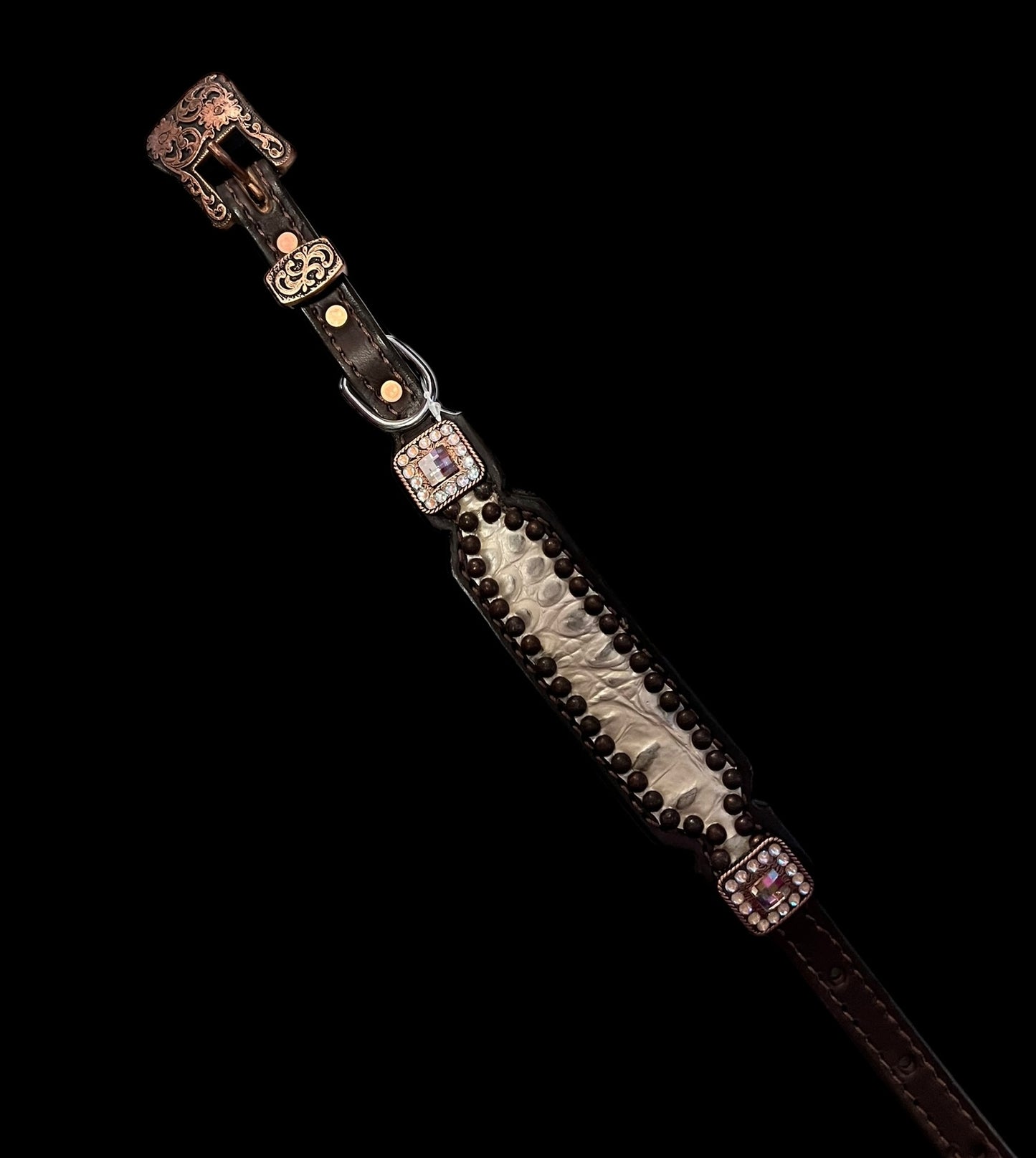 Champagne gator on dark leather