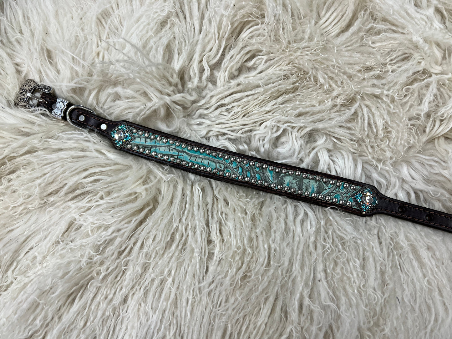 Antique turquoise gator on dark leather