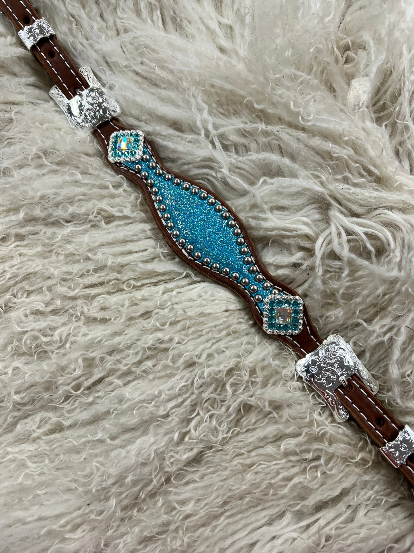 Turquoise sparkle on medium leather